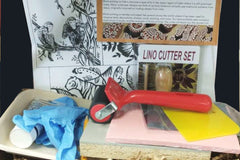 Our Block Printing Crate including a brayer, lino block, lino cutter, soft block, ink, carbon paper, brayer tray, gloves, more.