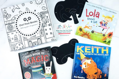 Owl Post Books kids gift subscription with holiday book box featuring Keith the Cat, Lola Knows a Lot, and This Book is Magic.