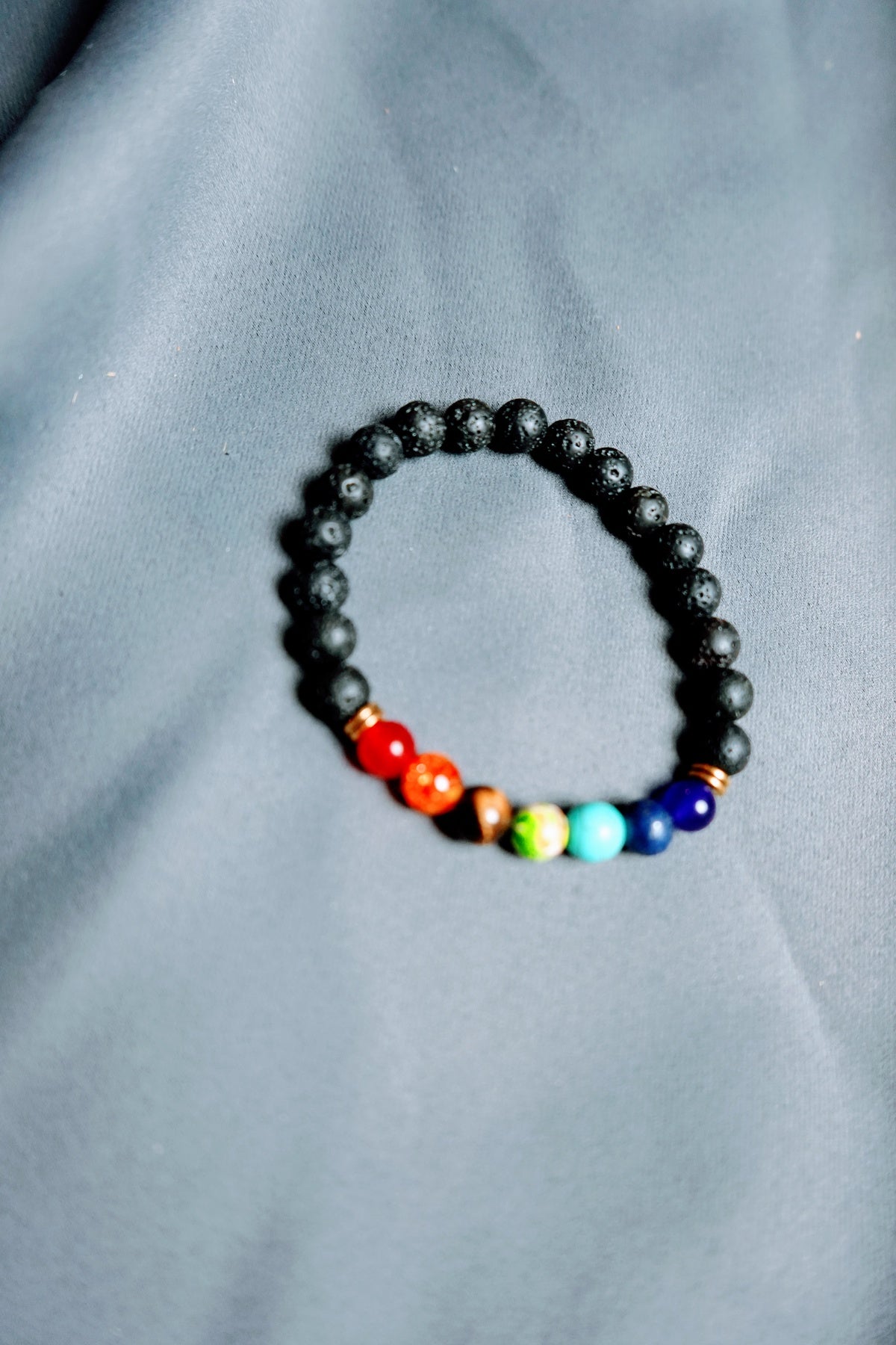 Lava rock bracelet of St. Damien (Black and colored beads)