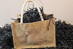 Charming small jute bag with handles—eco-friendly and perfect for gifting, storage, or a touch of rustic style.