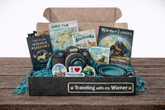 Cult of Wiener subscription box example featuring a themed magazine, dachshund accessories, and curated items designed for long-dog lovers.