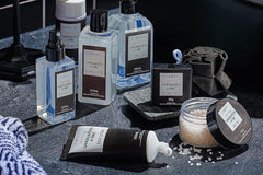 Photo of many skin care, spa and self care products for men. From location, serums to towels and bath salts.