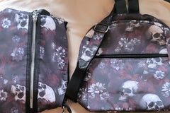 Medium sized gifts include a crossbody purse with a front pocket with zipper and a mini backpack with a front pocket with zipper