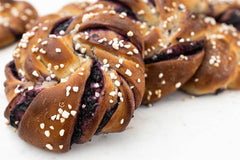 Blueberry Knots pastry baking kit featuring vegan braided pastry knots filled with blueberry, for a relaxing self care baking activity.