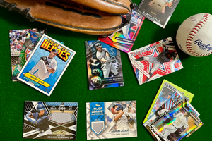 New York Yankees baseball cards arranged in flat lay format with a baseball glove and ball around them