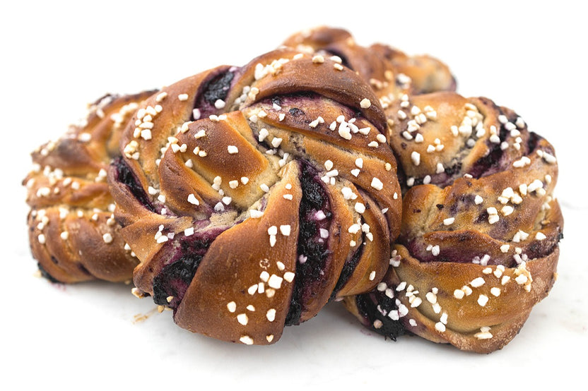 Blueberry Knots DIY baking kit featuring vegan braided pastry knots filled with blueberry, perfect for gifting or a fun night in.