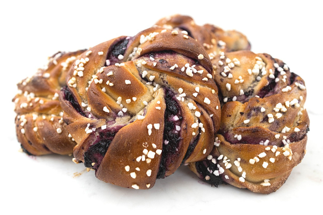 Blueberry Knots DIY baking kit featuring vegan braided pastry knots filled with blueberry, perfect for gifting or a fun night in.