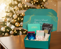 Senior Joy Welcome Box under a Christmas tree, featuring thoughtful gifts and cozy surprises for older loved ones.