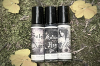 Muse Fragrances by SugarMuses® nestled in a small black box packed with organic moss and other botanicals.