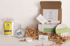 monthly sip + scent subscription box includes one travel-sized candle and one beverage of choice, plus a bookmark and sometimes a sticker.