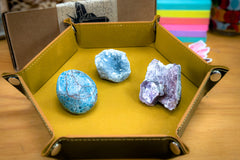 Enchanted Crystal Kids Crystal Box in a yellow felt-lined snap tray with three crystal varieties on display