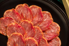 50% Iberico Loin Sliced by Fermin. Cured for a minimum of 70 days using artisanal methods in La Alberca, Spain. 2oz (57 gr)
