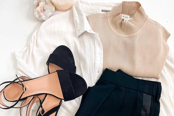 fresh summer fashion outfit with cream silk mock neck sleeveless top, low slung heeled sandals, black plaza pants to match and linen shirt