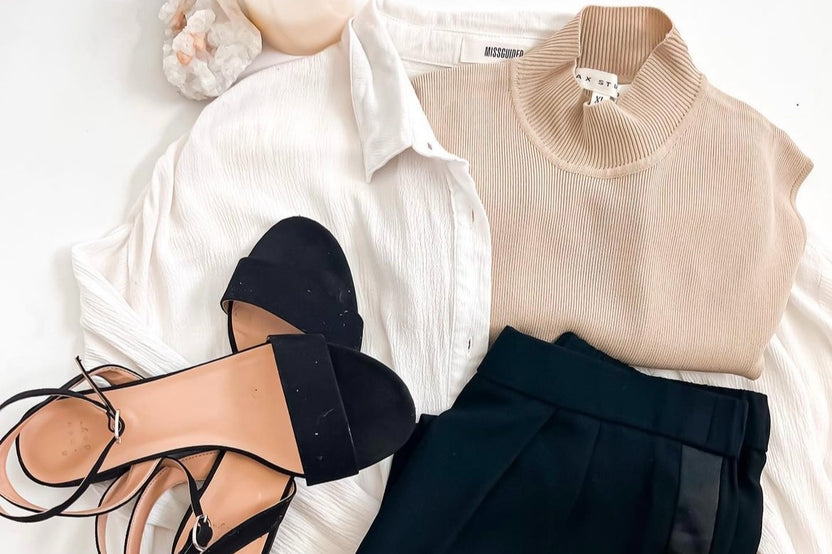 fresh summer fashion outfit with cream silk mock neck sleeveless top, low slung heeled sandals, black plaza pants to match and linen shirt
