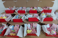birthday gift box filled with cute items, plush, squishy, mystery figure in a red box perfect for any occasion