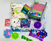 Easter  Teen Sensory Box - Ouisi Games, Starfish, glow stars, stretch worms, Dino squish, drizzler, glow ball, madmattr, fuzz bracelet