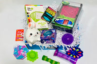 Easter  Teen Sensory Box - Ouisi Games, Starfish, glow stars, stretch worms, Dino squish, drizzler, glow ball, madmattr, fuzz bracelet