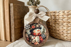 Handcrafted vintage-style wooden ornaments featuring art paper designs, finished with rustic details