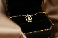 18k gold over silver 18In chain with 3 inch extender and an initial pendant encrusted with clear cubic zirconia gemstones 