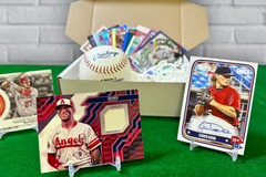 Los Angeles Angels baseball cards, including autographs and relics, arranged in display stands on a green carpet