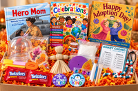 An open Celebrations box is filled with an activity guide, children's books and craft materials, keepsake and a candy treat.
