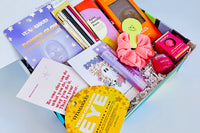 Colorful TEEN WISHBOX subscription box filled with self-care items, makeup, and positive messages, ideal as a holiday gift for teens