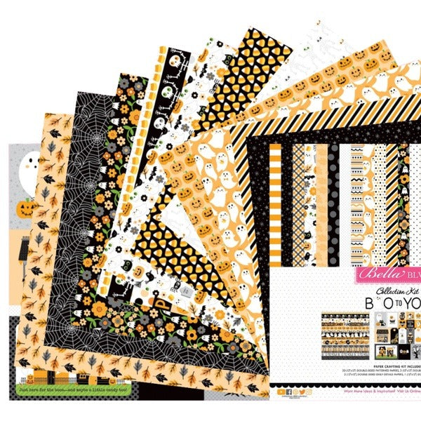 Halloween scrapbook papers with candy corn, ghost, spiderweb and jack-o'-lantern prints
