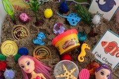 Kinetic sand
Hands on play
mermaid fun
learn and grow
skill builders 
learn about letters and numbers
sensory box 