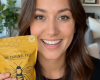 Woman holding Tree Caramels from Senior Joy Box, an artisanal holiday treat included in the December gift box.