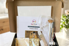 Art Club Monthly Teens and Adults box opened to show the canvas and the Gustav Klimt art history guide inside