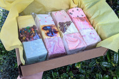 Gift-ready box of colorful marshmallows nestled in yellow tissue paper. By The Toasty Smore. Real marshmallows made with marshmallow root.