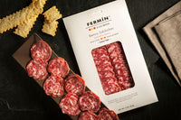 Salchichon Iberico Sliced by Fermin. A unique product of singular juiciness and delicate flavor, seasoned with nutmeg, black & white pepper.