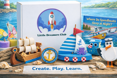 Branded image of the Little Dreamers Club .Navigating Our Waterways Craft Box and select crafts included in the box for ages 3-5.