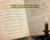 Open Busy Witch Box Sabbat ritual guide showing original invocation and ritual writing beside a lit candle on an altar cloth.