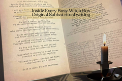 a ritual guide opened to the inside of the ritual guide showing original Sabbat ritual writing beside a lit candle on an altar cloth