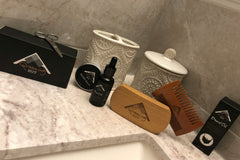 amateur taken photo of a few products lined up on a counter featuring mens spa and wellness products.