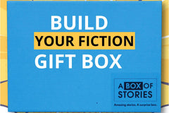 Brown box filled with fiction books, showcasing a variety of gripping titles and intriguing covers, perfect for mystery lovers.