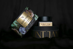 Two high quality and expensive products from the brand Saint Jane. The background of the photo is plain and black.