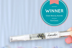 A close up of Greenmade goods Lavender Cuticle Oil, a Clean Beauty Winner badge in the upper right corner against a light background.