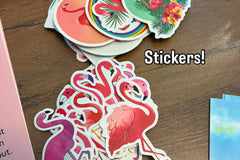 Flamingo stickers in 2 different stacks with the word stickers! Also part of the letter peaking out the corner of the photo on pink paper