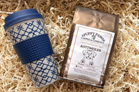 Box includes: 
one full-size  12oz bag of coffee , 
a themed lagniappe gift for the human 
and a sample treat for your furry friend