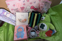 St Patrick's box with a green carebear plush, mystery figure box, hello kitty child handbag, green leg warmers, cute keychain , floral hair 