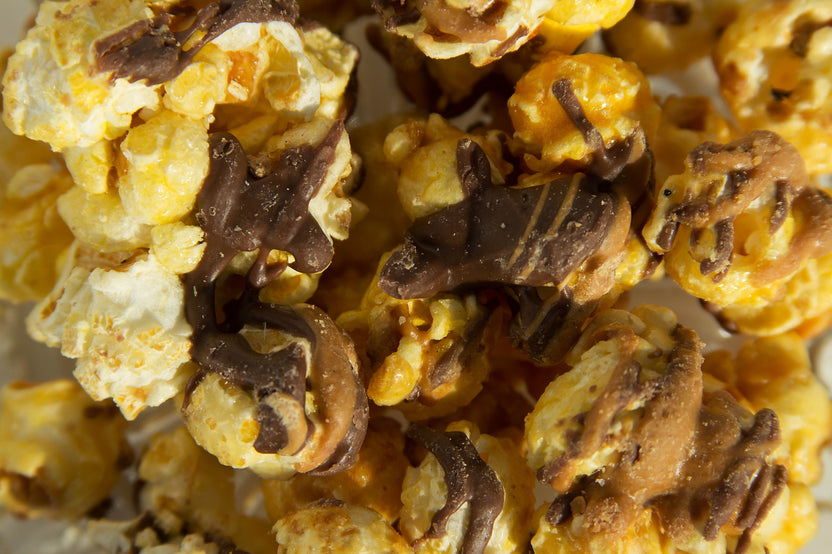 Indulge in Chocolate Peanut Butter Popcorn—rich vanilla popcorn drizzled with chocolate & peanut butter!