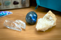 Enchanted Crystal Kids Crystal Box with three crystal varieties on display on a wooden table with a felt tray in the background