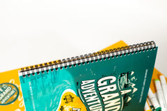 monthly sketchpad with daily drawing prompts with the theme grand adventure and drawing prompts that relate to locations and adventures.