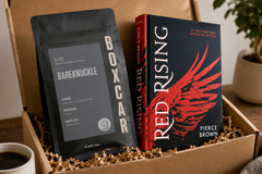Red Rising by Pierce Brown hardcover sci-fi novel with Boxcar Bareknuckle coffee in a monthly subscription box