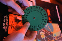 A cipher wheel from one of the murder mystery games with escape room puzzles from The Deadbolt Mystery Society.
