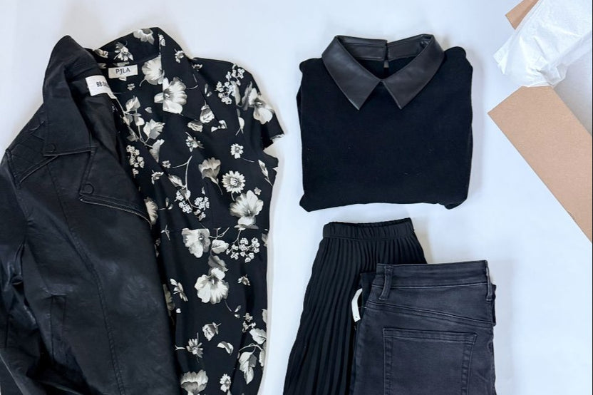 Example of a goth outfit we style, leather jacket, floral dress, vintage jeans, a skirt and top to match.