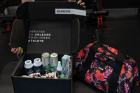 This photo shows an open Gainz Box of the Q3 2024 variety, highlighting different products in the box, including a colorful Vooray duffel.