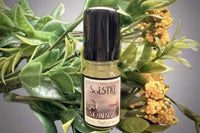 Muse Fragrances by SugarMuses® nestled in a small black box packed with organic moss and other botanicals.